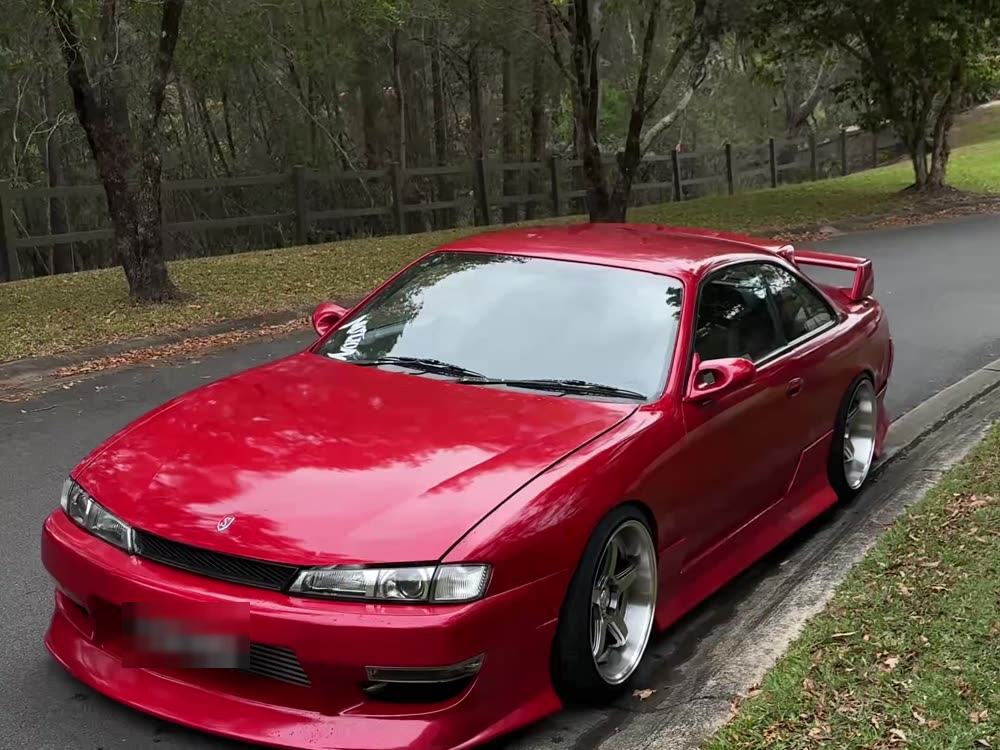 Red sports coupe cleaned and dressed
